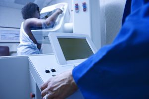 Woman getting mammogram