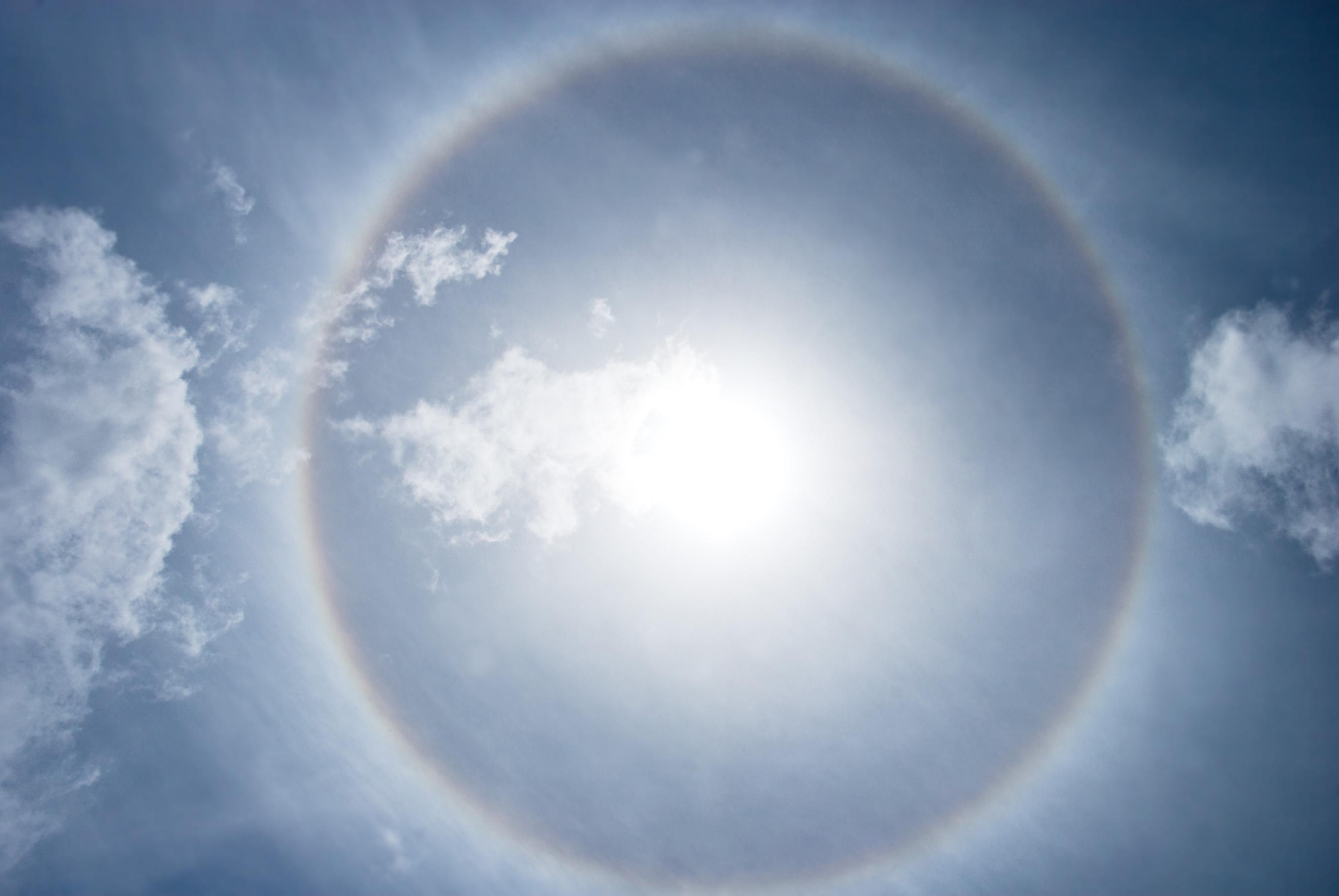 halo nimbus or gloriole around bright sunbeam and sky